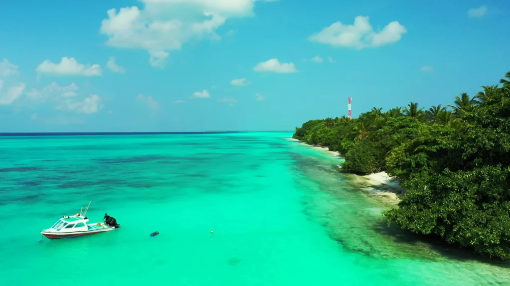 Aerial view of a boat on the turquoise waters of Cozumel.